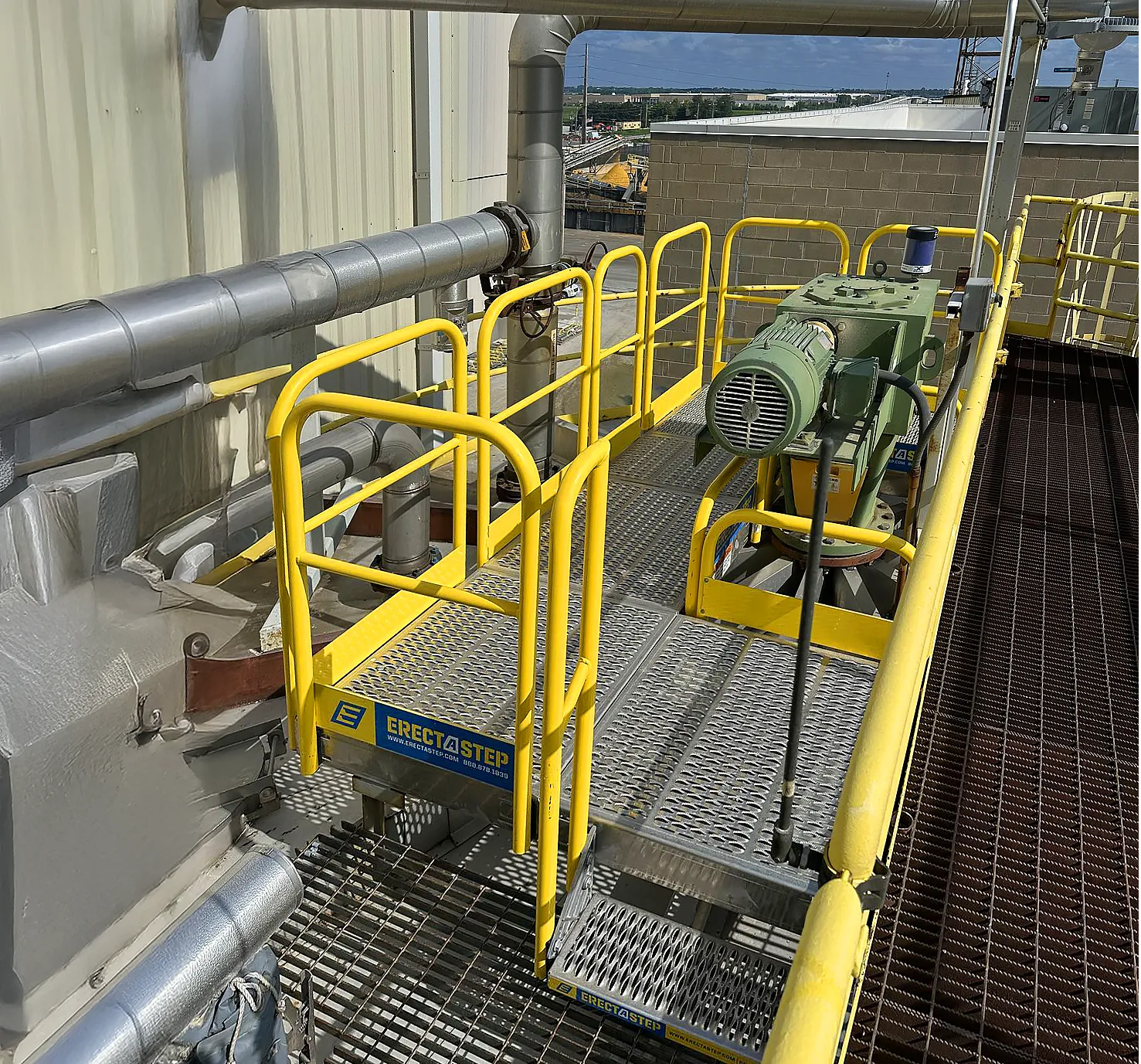 ErectaStep work platform accessing equipment